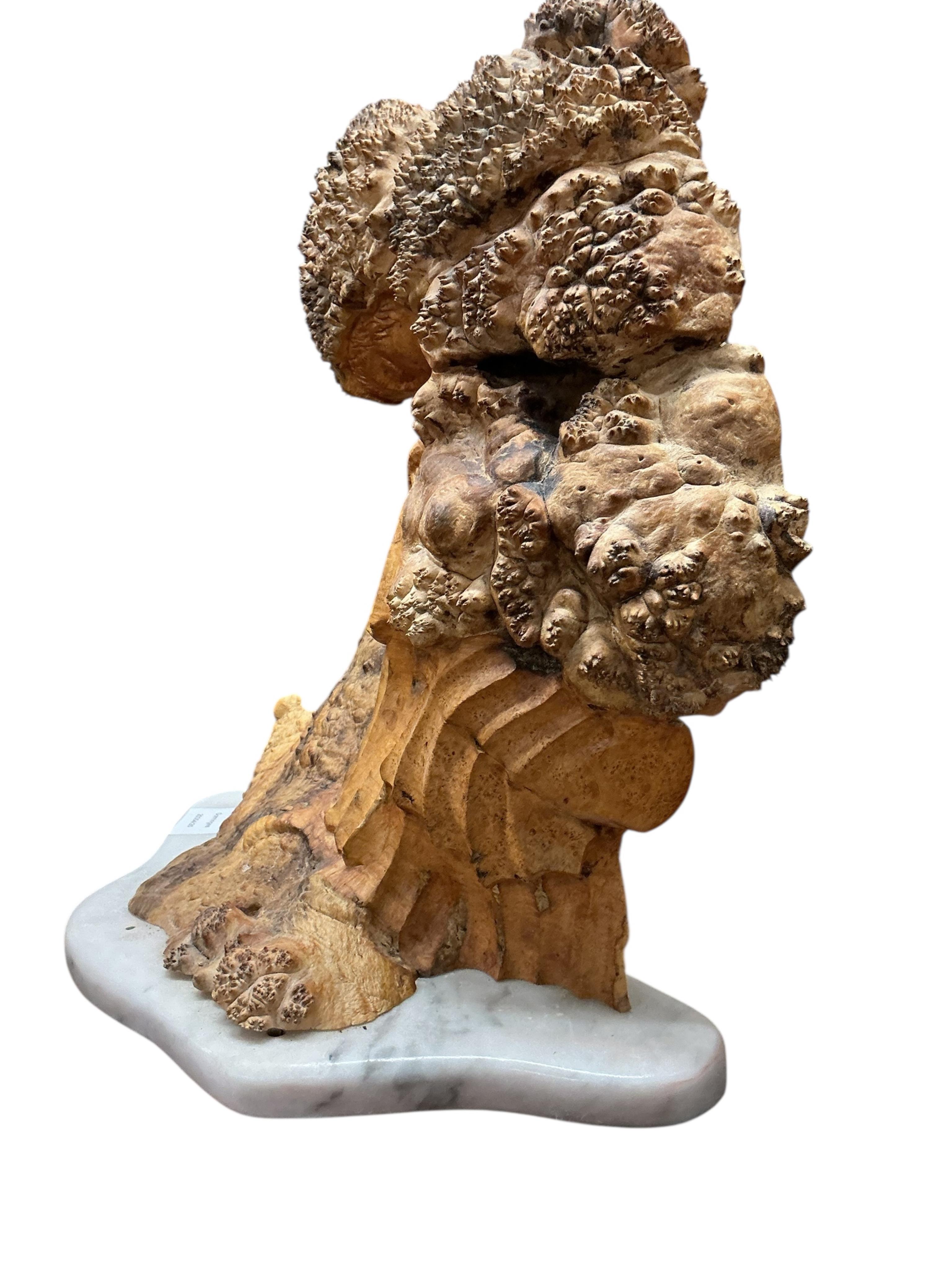 Pierre Decorse (b.1953), a stylised sculpture of a woman with head bowed, raised on a white marble base, height 40cm